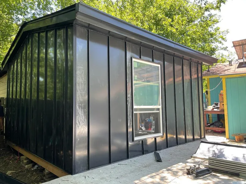 Black standing seam metal wall panels for Roof Inspection in Huntington